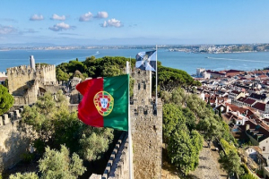 Portugese flag on castle, overseeing the river.